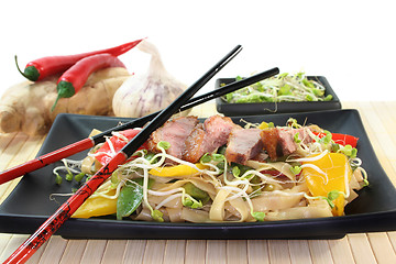 Image showing Duck breast with fried noodles