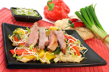 Image showing Duck breast with fried noodles