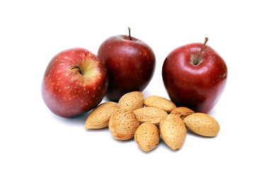 Image showing Fresh red apples with nuts