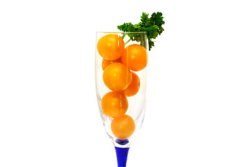 Image showing Glass is filled by yellow tomatoes