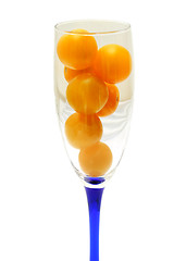 Image showing Glass is filled by yellow tomatoes