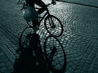 Image showing Late shopping cyclist