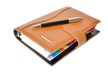 Image showing Daily planner with pen on a white background