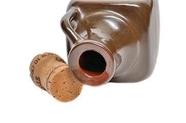 Image showing Ceramic bottle and a cork on a white background
