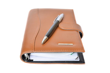 Image showing Daily planner with pen on a white background