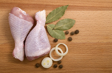 Image showing raw chicken meat with herbs, onions and peppers