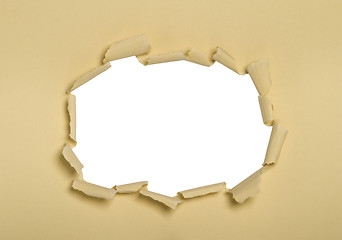 Image showing a hole punched into cream paper