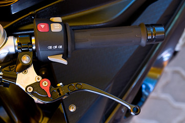 Image showing Handlebar and brake lever of a large motorbike