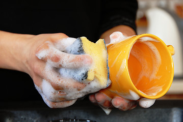 Image showing Washing dishes