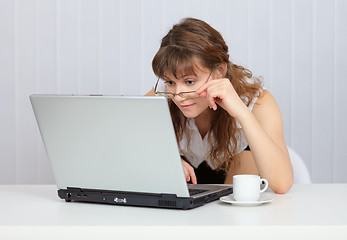 Image showing Young girl with glasses working in Internet