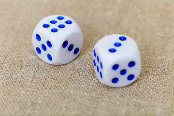 Image showing Two dice on coarse linen