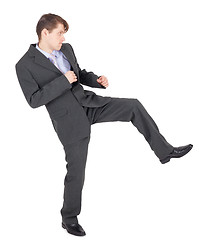 Image showing Young businessman kicks as karate