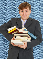 Image showing Funny guy with an armful of textbooks