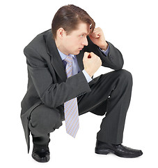 Image showing Businessman sitting in defensive pose