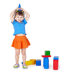 Image showing Little girl playing with colored blocks