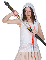 Image showing Girl teen slowly takes out katana from sheath