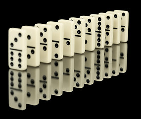 Image showing Dominoes ranked on black background with reflection