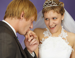 Image showing Gallant groom kisses hand