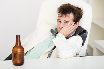 Image showing Guy is suffering from hangover because beer is gone