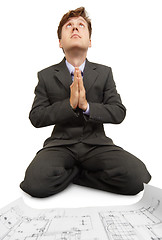 Image showing Engineer prays to God