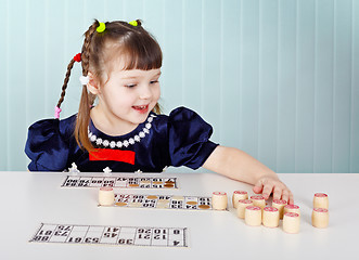 Image showing Little girl playing with lotto