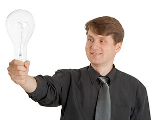 Image showing Satisfied man holding a light bulb