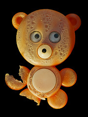 Image showing Old chewed toy - bear on black background