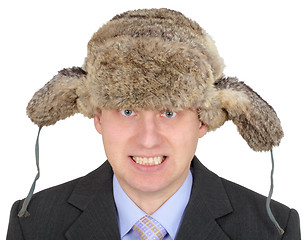 Image showing Angry Russian businessman in fur hat on white