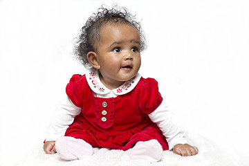 Image showing Baby girl learning to sit