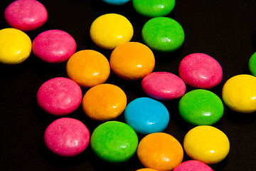 Image showing Colorful candy on black background