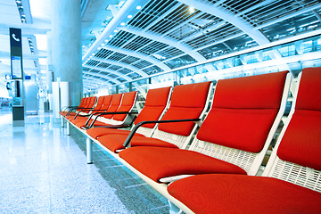 Image showing long red chair in building