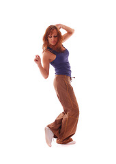 Image showing attractive teenage dancing over white background