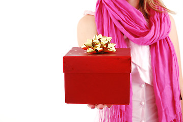 Image showing Female hands giving a christmas gift