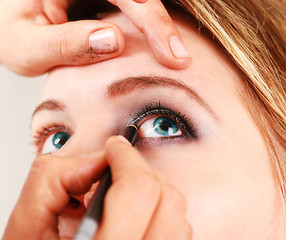 Image showing Stylist is applying eyeshadow 