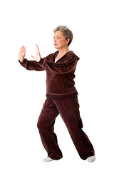 Image showing Senior woman doing Tai Chi Yoga exercise