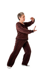 Image showing Senior woman doing Tai Chi Yoga exercise