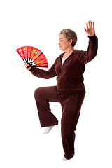 Image showing Senior woman doing Tai Chi Yoga exercise