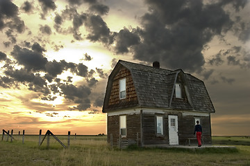 Image showing Person entering an old house.