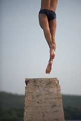 Image showing Man jumping from diving platform