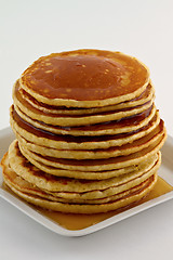 Image showing Stack of pancakes with syrup