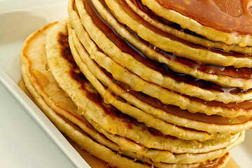 Image showing Stack of pancakes with syrup