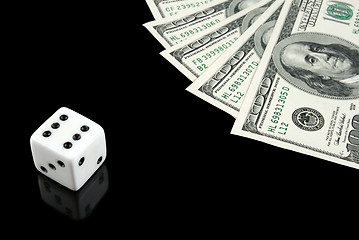 Image showing White dice and money on black background