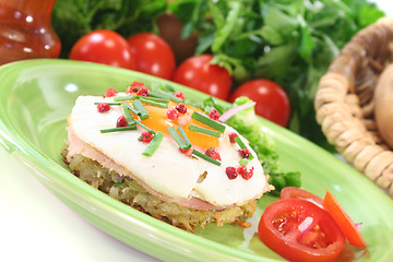 Image showing Hash browns with fried egg