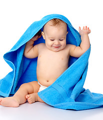 Image showing Cute child wrapped in blue towel