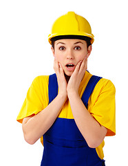 Image showing Construction girl holding her face in astonishment