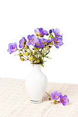 Image showing Wild flowers in a vase, it is isolated on the white