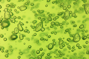 Image showing Air vials in a green liquid. A background 