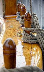 Image showing Ropes and polished wood on the deck of an old ship