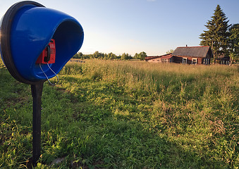 Image showing modern phone in old village