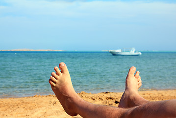 Image showing man foots on beach